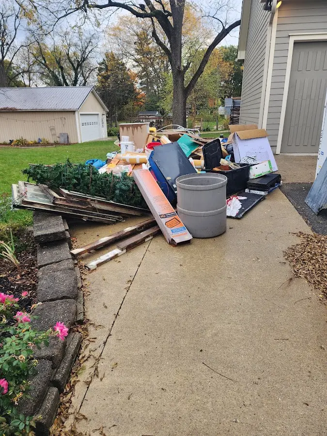 Dumpster being loaded with debris for 30 Yard Dumpster Rental in Grove City